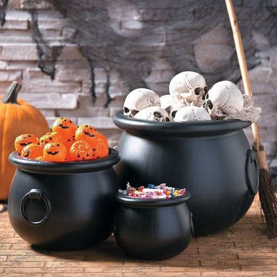 Small cauldron surrounded by faux potions, candles, and dried herbs, creating a whimsical centerpiece for a mystical dinner gathering.