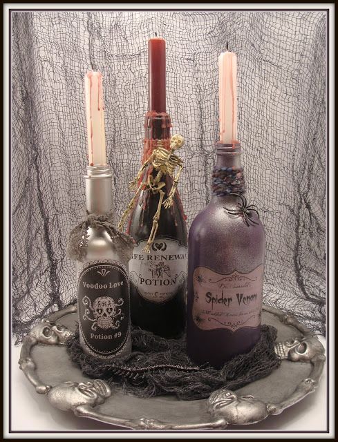 Glass bottles with spooky labels like "Witch's Brew" filled with colored liquids.